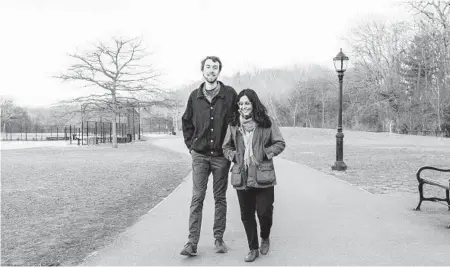  ?? CHRIS FACEY/THE NEW YORK TIMES ?? Colin Kinniburgh, left, and Ashraya Gupta pose March 15 in Brooklyn’s Prospect Park. He has not been vaccinated, but she has.