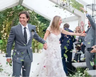  ??  ?? Gwyneth Paltrow and new husband, Brad Falchuk. The actress has just shared exclusive pictures of her wedding on her website GOOP.