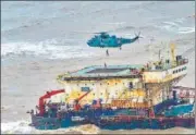  ?? PTI ?? An Indian Navy personnel on Thursday rescuing the crew of GAL Constructo­r which ran aground off Mumbai coast.