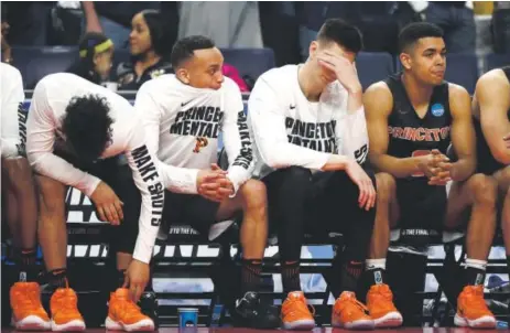  ??  ?? The Princeton players lament seeing their season come to an end against Notre Dame on Thursday in Buffalo, N.Y.