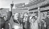  ?? AP ?? Notre Dame head coach Brian Kelly, left, daughter Grace, center, and wife Paqui, celebrate Notre Dame’s 41-13 win over Wisconsin on Sept. 25 in Chicago.