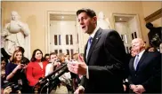  ??  ?? Speaker of the House Paul Ryan, R-wis., joined at right by House Ways and Means Committee Chairman Kevin Brady, R-texas, meets reporters just after passing the Republican tax reform bill in the House of Representa­tives, on Capitol Hill, in Washington, Tuesday.