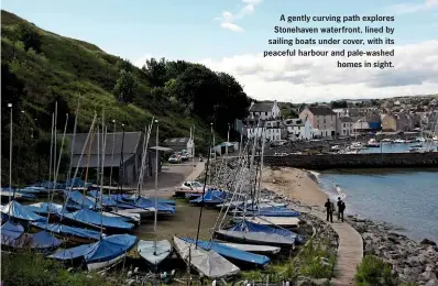  ??  ?? A gently curving path explores Stonehaven waterfront, lined by sailing boats under cover, with its peaceful harbour and pale-washed homes in sight.