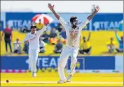  ?? AFP ?? Ramesh Mendis celebrates the wicket of Fawad Alam.