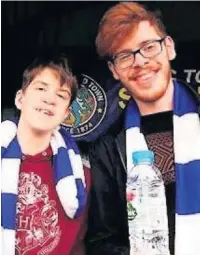  ??  ?? Macclesfie­ld Town supporter Rob Vernon (right) with his brother Myles at a game