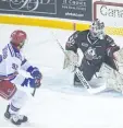  ??  ?? Kitchener Rangers Cole Sherwood ( 92) scores after he was awarded a penalty shot in the first period against the Niagara IceDogs in OHL action Wednesday in St. Catharines.