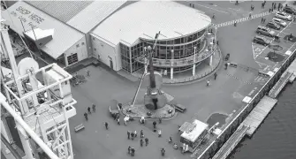  ?? DAVID JALA • CAPE BRETON POST ?? It’s still unknown exactly when the next cruise ship will dock in Sydney, but industry insiders are buoyed by market optimism that the industry will resume in 2022. This file photograph offers a bird’s eye view of the Joan Harriss Cruise Pavilion from atop the bow of the MSC Meraviglia, the sixth-largest cruise ship in the world, on its October 2019 visit to Sydney.