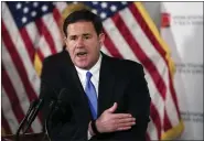  ?? AP FILE ?? In this Dec. 2, 2020, file photo, Arizona Republican Gov. Doug Ducey answers a question during a news conference in Phoenix.