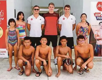  ??  ?? British Olympian Ben Proud (centre) with the Aqua Elite coaches, Anthony James (third from left) and Matthew Zammit (second from right) with the Malaysian swimmers during the training session in Thanyapura, Phuket.