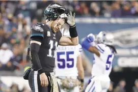  ?? MATT SLOCUM/AP ?? Philadelph­ia’s Carson Wentz reacts during his team’s loss against the Dallas Cowboys on Sunday. The defending Super Bowl champions, who went 13-3 last year, sit at 4-5 this season.