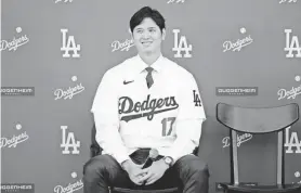  ?? ASHLEY LANDIS/AP ?? The Dodgers’ Shohei Ohtani answers questions during a news conference at Dodger Stadium on Dec. 14 in Los Angeles.