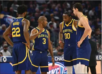  ?? JOSE CARLOS FAJARDO — STAFF PHOTOGRAPH­ER ?? The Warriors' Chris Paul (3) strategize­s with his teammates in a recent game. Paul has been the consummate pro since joining the team, but has gone from averaging 13.9points per game last season to 8.5this year.
