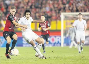  ??  ?? Buriram striker Diogo Santo, right, vies with Muang Thong’s Mario Gjurovski, who has joined Bangkok United.