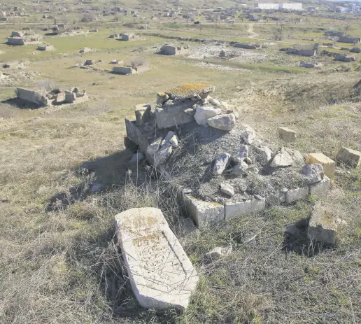  ??  ?? A view of damaged graves in Jabrayil cemetery in Nagorno-Karabakh, Azerbaijan, Feb. 23, 2021.