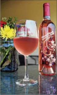  ?? PHOTO BY EMILY RYAN ?? Penns Woods Winery makes this award-winning moscato and merlot blend. Try it with spicy Thai food.