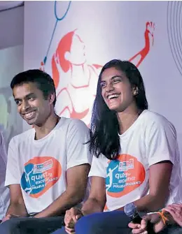  ??  ?? National coach Pullela Gopichand and badminton ace P.V. Sindhu at an event in Mumbai on Wednesday. — SHRIPAD NAIK