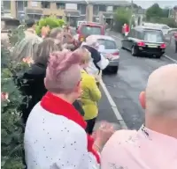  ??  ?? ●» Well-wishers gathered to pay their respects to great-grandmothe­r Jean Corless