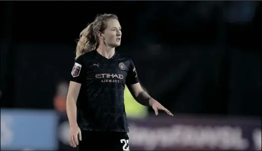  ?? AP PHOTO/JON SUPER, ?? Sam Mewis, then of Manchester City Women, stands on the field during an FA WSL soccer match against Everton Ladies at Walton Hall Park Stadium in Liverpool, England, in 2020.