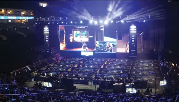  ?? GLENN CHAPMAN/AFP/GETTY IMAGES ?? Fans watch as 80 players simultaneo­usly fight for survival in an eSports match of PlayerUnkn­own’s Battlegrou­nds held at an Intel Extreme Masters tournament at the Oracle Arena in California.