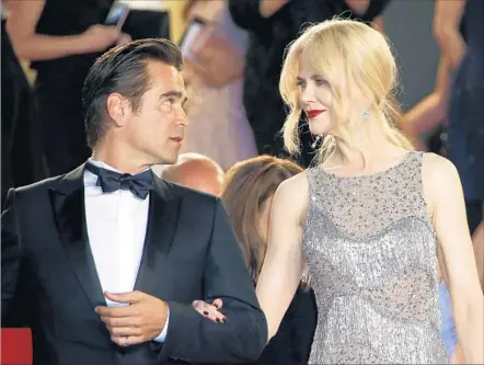  ?? Photograph­s by Sebastien Nogier European Pressphoto Agency ?? NICOLE KIDMAN, who was given a special award by the festival, leaves the recent “Beguiled” premiere at Cannes with Colin Farrell.