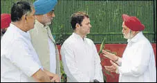  ?? HT PHOTO ?? Amrik Singh Dhillon (R) talks to Congress president Rahul Gandhi as (from left) Rakesh Pandey and Randeep Singh Nabha look on, in New Delhi on Tuesday.