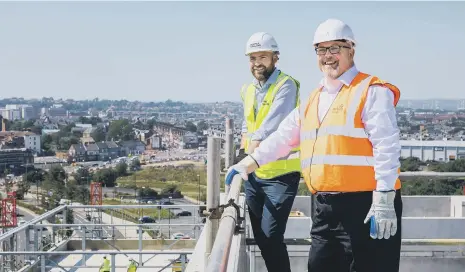  ??  ?? At the new Sunderland City Hall topping out Coun Graeme Miller, right, and Paul Anderson, Senior Project Manager at Bowmer + Kirland.