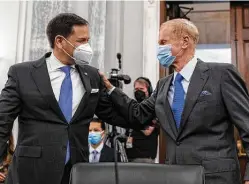  ?? Graeme Jennings / Associated Press ?? Former Sen. Bill Nelson, right, nominee to be administra­tor of NASA, greets Sen. Marco Rubio, R-Fla., before Wednesday’s confirmati­on hearing.