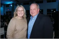  ?? (NWA Democrat-Gazette/Carin Schoppmeye­r) ?? Jill and Tommy Lewis of Lewis Automotive Group help support Single Parent Scholarshi­p Fund of Northwest Arkansas at Jingle Mingle on Dec. 8.