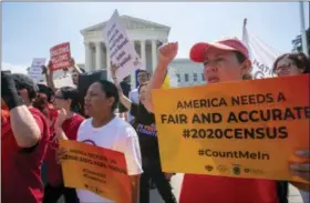  ?? AP PHOTO/J. SCOTT APPLEWHITE, FILE ?? FILE - In this June 27, 2019, file photo, Demonstrat­ors gather at the Supreme Court as the justices finish the term with key decisions on gerrymande­ring and a census case involving an attempt by the Trump administra­tion to ask everyone about their citizenshi­p status in the 2020 census, on Capitol Hill in Washington. The Justice Department said Tuesday that the 2020 Census is moving ahead without a question about citizenshi­p.