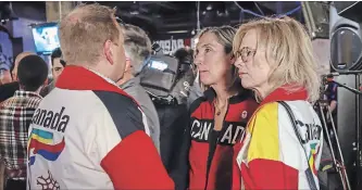  ?? CANADIAN PRESS FILE PHOTO ?? Dave King, left, and members of his family react to results of the Nov. 13 plebiscite on whether Calgary should proceed with a bid for the 2026 Winter Olympics. Fifty-six per cent voted against making a bid.