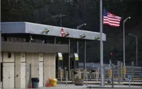  ?? THE ASSOCIATED PRESS ?? The Fort Littleton Pennsylvan­ia turnpike exit flies a U.S. flag at half staff March 21 after a shooting, in Littleton, Pa.