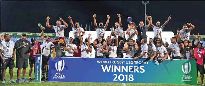  ?? Photo: World Rugby ?? Vodafone Fijian Under-20 players and officials celebrate after winning the World Rugby Under-20 Trophy in Bucharest, Romania on September 10, 2018.