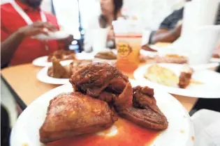  ?? JOE RONDONE/THE COMMERCIAL APPEAL ?? Uncle Lou’s chicken, served to the CA staff as they enjoy lunch at the southside restaurant on Tuesday, Aug. 6, 2019.