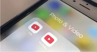  ?? JENNY KANE/AP ?? The YouTube app and YouTube Kids app are displayed on an iPhone.