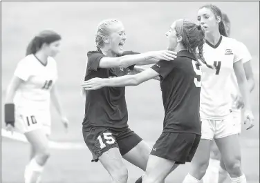  ?? NWA Democrat-Gazette/JASON IVESTER ?? Bentonvill­e High freshman Sydney Suggs (left) celebrates with senior Emma Welch on Saturday after scoring the opening goal of the Class 7A state championsh­ip match against Cabot at Razorback Field in Fayettevil­le.