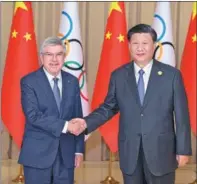  ?? LIU BIN / XINHUA ?? President Xi Jinping meets with Internatio­nal Olympic Committee President Thomas Bach in Hangzhou, Zhejiang province, on Sept 22.