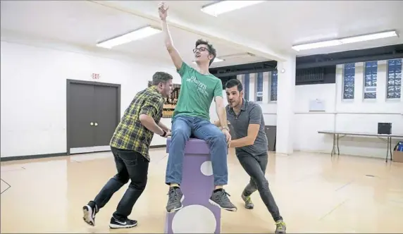  ?? Antonella Crescimben­i/Post-Gazette photos ?? Adam Speers, as Eddie Birdlace; Michael Tarasovich, as Bernstein; and Ryan Hadbavny, as Boland rehearse for Studio 62’s production of “Dogfight.”