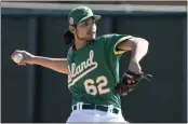  ?? MORRY GASH — THE ASSOCIATED PRESS ?? The Oakland Athletics’ Freddy Tarnok throws during a spring training workout on Monday in Mesa, Ariz.