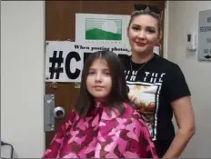  ?? PHOTO ANDY VELEZ ?? Rhyanna Velazco, 9, finishes getting a free trim from hairstylis­t Elena Perez at Saturday’s backto-school event organized by the Starts with Arts Foundation and the Cancer Resource Center of the Desert.