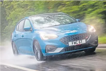  ??  ?? RACING AHEAD: The Ford Focus ST has a 2.3 litre turbocharg­ed engine with 276bhp.