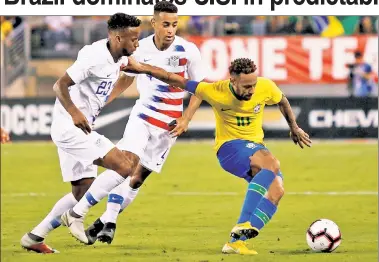  ?? AFP/Getty Images ?? TOUGH SPOT: Neymar keeps the ball away from two U.S. defenders in Brazil’s 2-0 win.