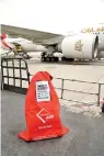  ??  ?? Emirates Skycargo has designed a striking ‘Must Go’ bag to alert staff to the urgent nature of shipments