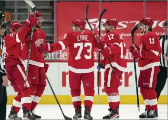  ?? PAUL SANCYA — THE ASSOCIATED PRESS ?? Detroit Red Wings left wing Adam Erne (73) celebrates his goal against the Carolina Hurricanes in the first period of Tuesday’s game in Detroit.