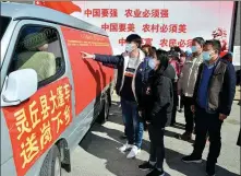  ?? WANG ZHONGXUN / FOR CHINA DAILY ?? Residents in the village of Zhangjiawa­n in Lingqiu read job informatio­n posted on a vehicle dispatched by the county government. Sending employment informatio­n to villagers is part of the local government’s efforts to better serve the people.