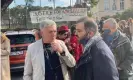  ?? Helena Smith/The Guardian ?? Greek MEP Stelios Kouloglou (left) outside the appeals court in Lesbos with human rights lawyer Alexandros Georgoulis. Photograph: