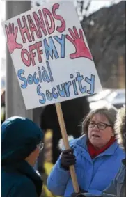  ?? PETE BANNAN – DIGITAL FIRST MEDIA ?? Susan Cassanelli of Havertown protests outside U.S. Rep. Pat Meehan’s Springfiel­d office Sunday, following U.S. Sen. Bernie Sanders’ call for nationwide rallies to protest GOP plans to dismantle Obamacare and revamp Medicaid. “I’m concerned Pat Meehan...