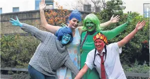  ?? Pictures: Mhairi Edwards. ?? Left: Team Sweet and Sour go down the finish slide. Top: some of the participan­ts warming up. Above: Jaime Benjamin, Bethany Starkey, Charlotte Starkey and Rachael Smith get into the spirit of the event.