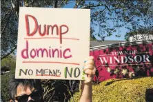  ?? Jessica Christian / The Chronicle ?? Windsor resident Lillian Fonseca protests against Mayor Dominic Foppoli at Highway 101 and Old Redwood Highway.