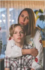  ?? RYAN JACKSON/THE CANADIAN PRESS ?? Nadiia Kuzniak and son Yurii fled Ukraine for Edmonton in April but the pull to return home was strong.