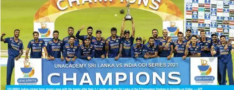  ?? — AFP ?? COLOMBO: Indian cricket team players pose with the trophy after their 2-1 series win over Sri Lanka at the R Premadasa Stadium in Colombo on Friday.